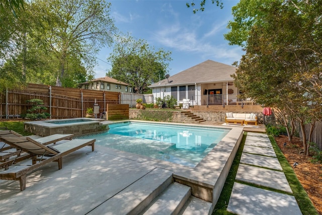 view of swimming pool featuring stairway, a fenced backyard, an in ground hot tub, a fenced in pool, and an outdoor hangout area
