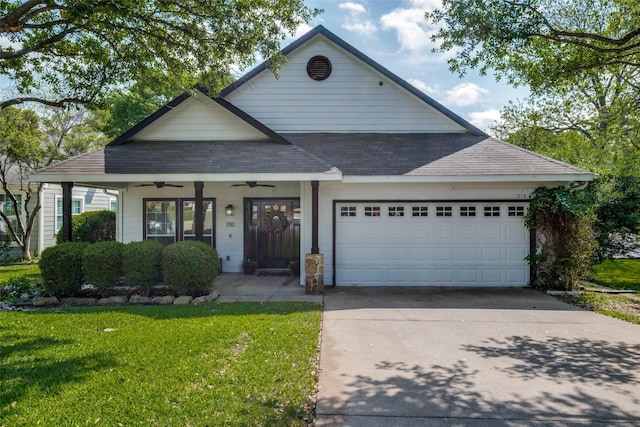 view of front of house with a ceiling fan, a shingled roof, a front lawn, driveway, and a garage