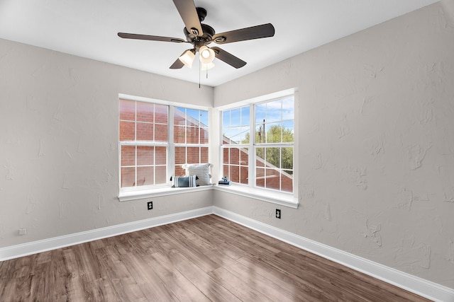 1014 S Ballard Ave, Wylie, TX 75098 - empty room featuring a ceiling fan, wood finished floors, and baseboards