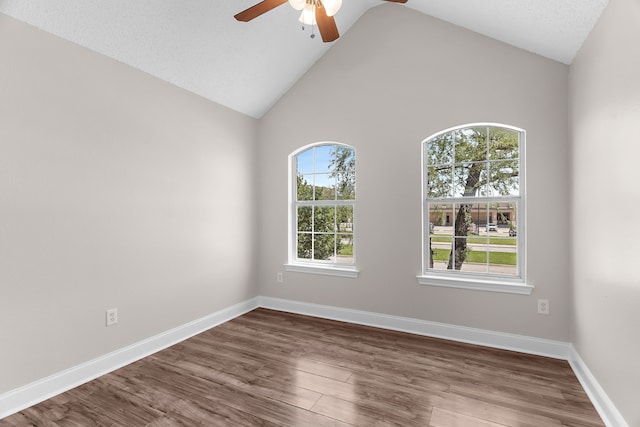 1014 S Ballard Ave, Wylie, TX 75098 - unfurnished room with ceiling fan, dark wood-style floors, high vaulted ceiling, and baseboards