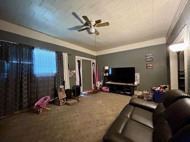 living room featuring a ceiling fan and carpet