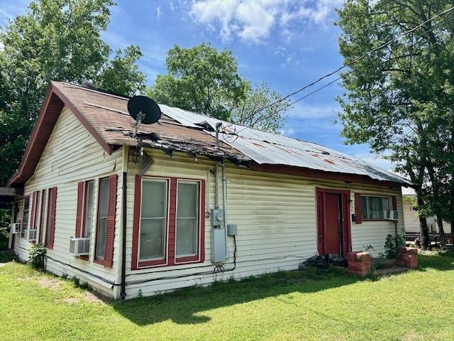 view of home's exterior featuring a yard