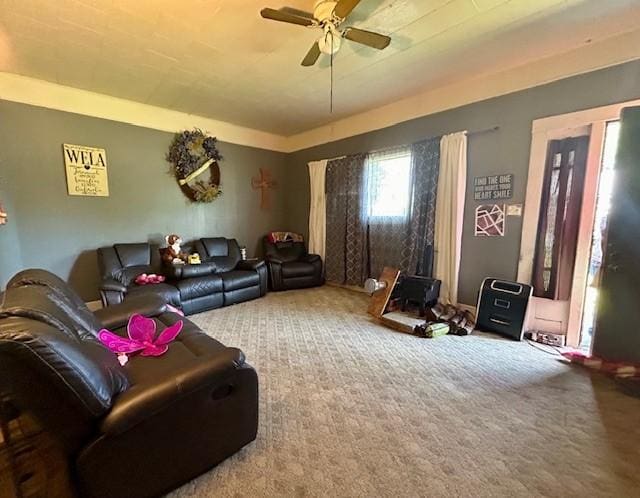 living room featuring carpet floors and a ceiling fan