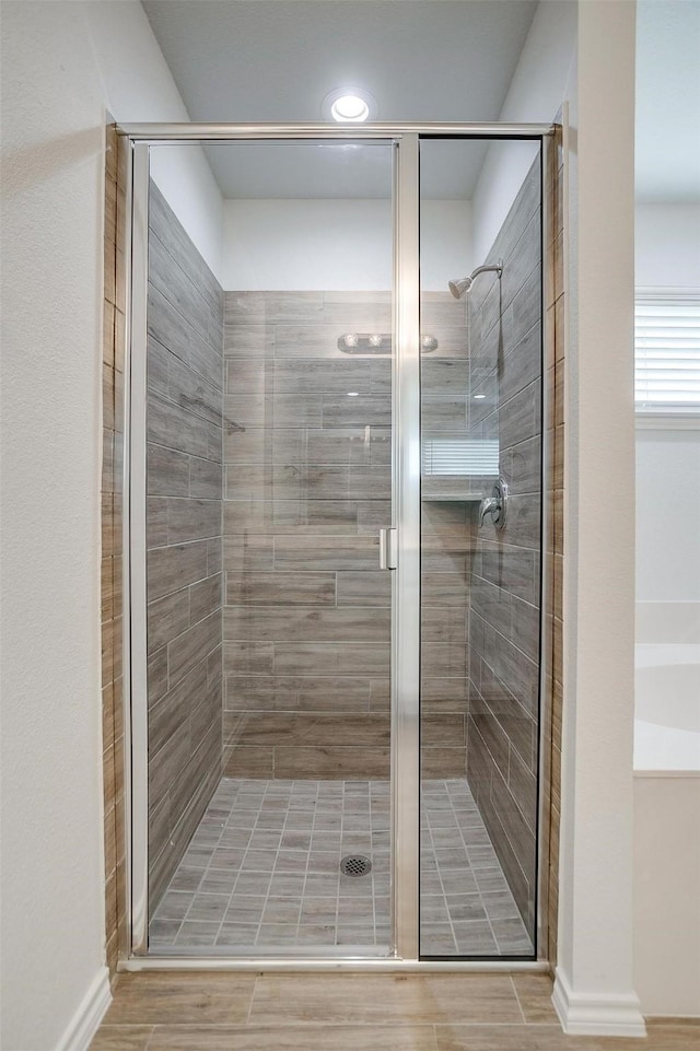 bathroom featuring a shower stall