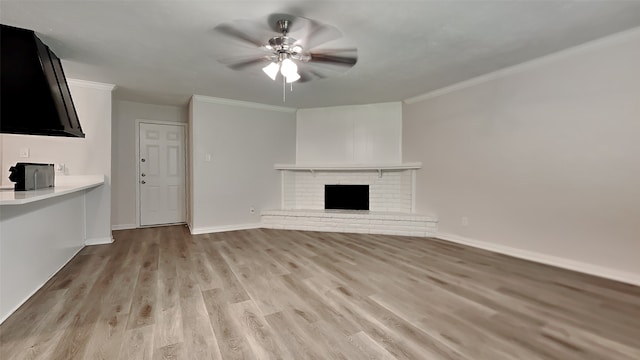 1814 Novel Dr, Garland, TX 75040 - unfurnished living room featuring ceiling fan, baseboards, ornamental molding, and light wood-type flooring