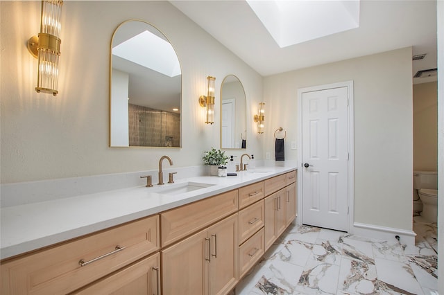 9603 Greensprint Dr, Dallas, TX 75238 - bathroom with a skylight, double vanity, marble finish flooring, and a shower