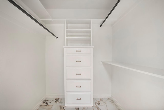 9603 Greensprint Dr, Dallas, TX 75238 - walk in closet featuring light marble finish flooring