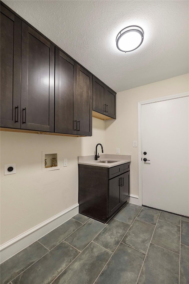 9603 Greensprint Dr, Dallas, TX 75238 - washroom with hookup for an electric dryer, cabinet space, hookup for a washing machine, and a textured ceiling