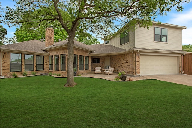 9603 Greensprint Dr, Dallas, TX 75238 - back of property featuring brick siding, an attached garage, a chimney, a lawn, and driveway