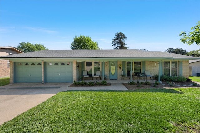 ranch-style house featuring driveway, covered porch, brick siding, a front yard, and a garage