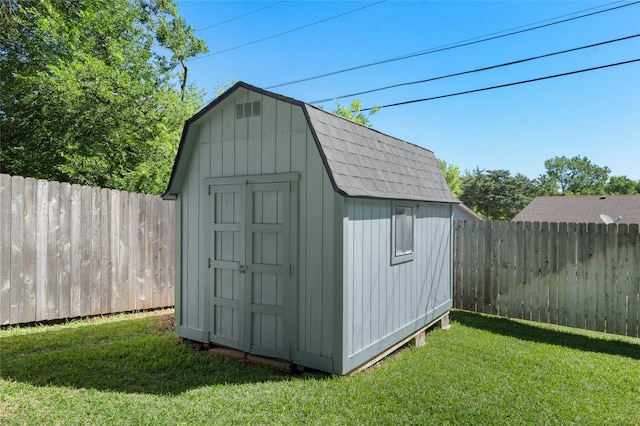 view of shed featuring a fenced backyard