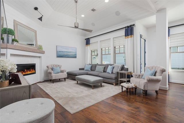 living area featuring visible vents, baseboards, wooden ceiling, a fireplace, and wood-type flooring