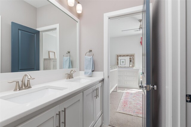 full bath featuring a sink and double vanity