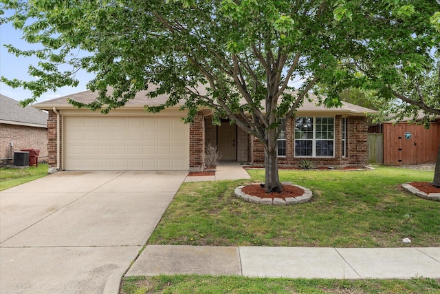 view of front of house with brick siding, an attached garage, driveway, and fence