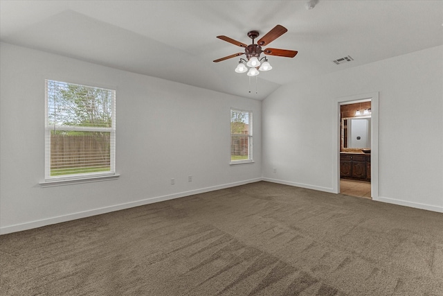 unfurnished bedroom with carpet, visible vents, baseboards, and multiple windows