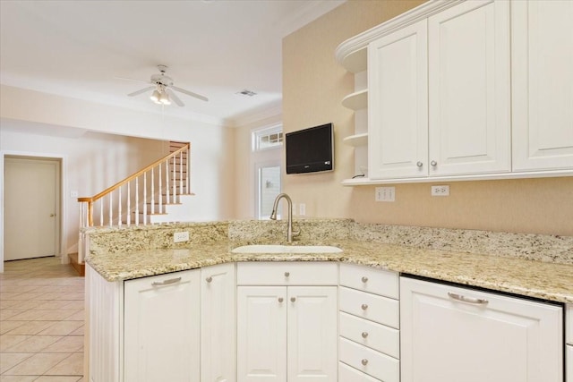 kitchen with a ceiling fan, open shelves, a sink, a peninsula, and visible vents