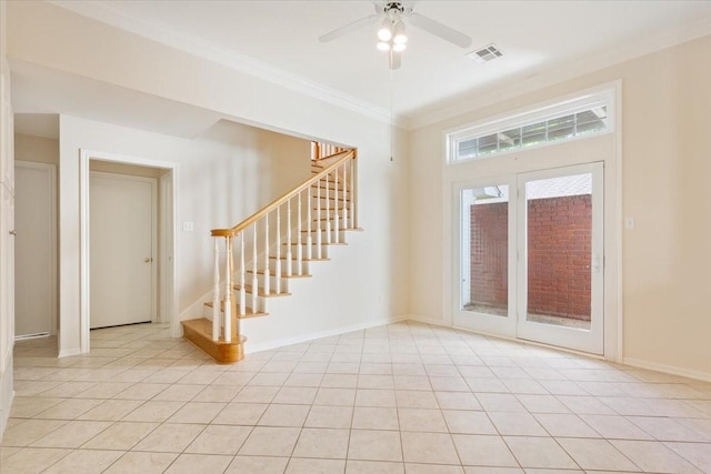 interior space featuring crown molding, visible vents, ceiling fan, stairway, and light tile patterned floors
