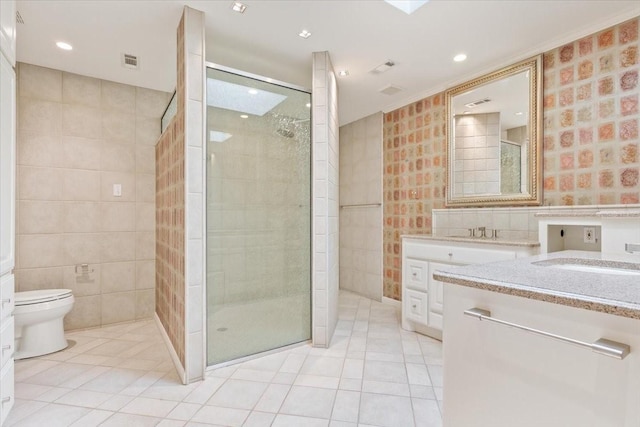 full bath featuring tile walls, visible vents, tile patterned flooring, and a shower stall