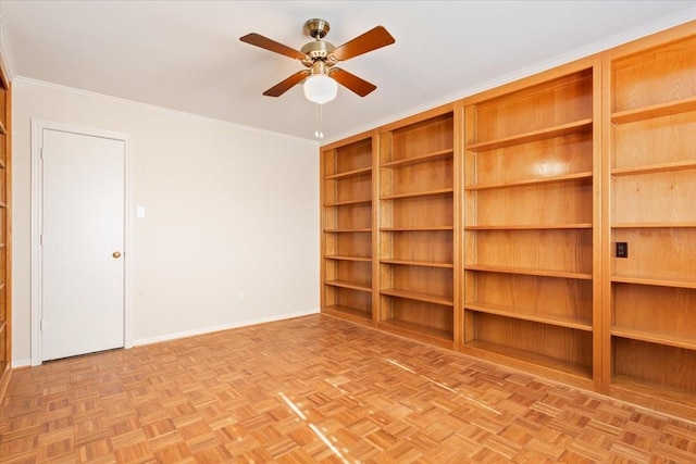 empty room featuring baseboards, a ceiling fan, and crown molding