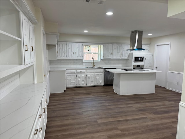 kitchen featuring dishwasher, island range hood, a sink, tasteful backsplash, and white cabinetry