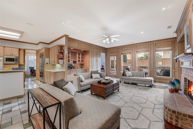 4524 Tuscany Dr, Plano, TX 75093 - living room with a fireplace, a ceiling fan, ornamental molding, and recessed lighting