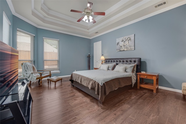 4524 Tuscany Dr, Plano, TX 75093 - bedroom featuring a tray ceiling, crown molding, wood-type flooring, baseboards, and ceiling fan