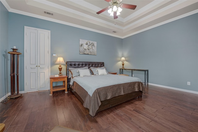 4524 Tuscany Dr, Plano, TX 75093 - bedroom with a raised ceiling, hardwood / wood-style flooring, baseboards, crown molding, and a ceiling fan