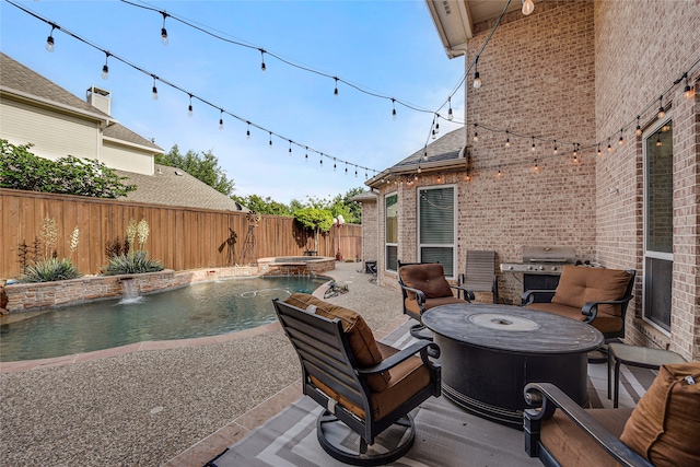 4524 Tuscany Dr, Plano, TX 75093 - fenced backyard featuring a patio area, area for grilling, an outdoor fire pit, and a pool with connected hot tub