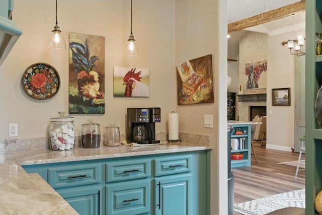 bar featuring wood finished floors, beamed ceiling, decorative light fixtures, crown molding, and a fireplace