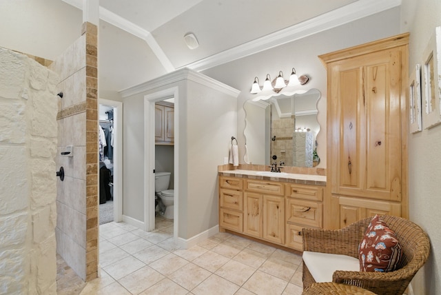 bathroom featuring lofted ceiling, tile patterned floors, vanity, crown molding, and tiled shower