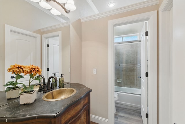 bathroom featuring shower / bath combination with glass door, wood finished floors, toilet, vanity, and crown molding