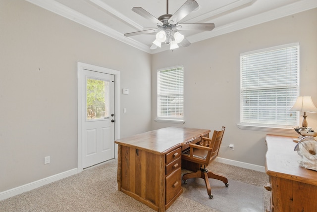 office space with light carpet, a ceiling fan, baseboards, and ornamental molding
