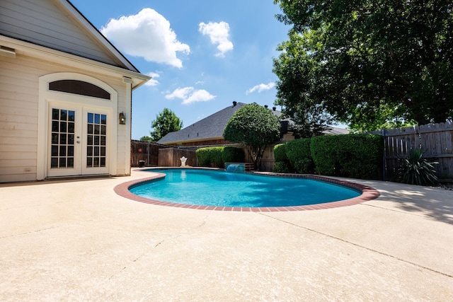 2611 Logan Dr, Mansfield, TX 76063 - view of pool with a patio, a fenced backyard, and french doors