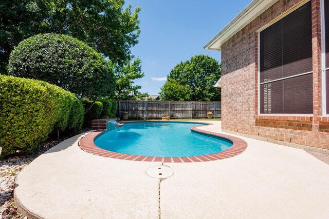 2611 Logan Dr, Mansfield, TX 76063 - view of swimming pool featuring a patio area and a fenced backyard