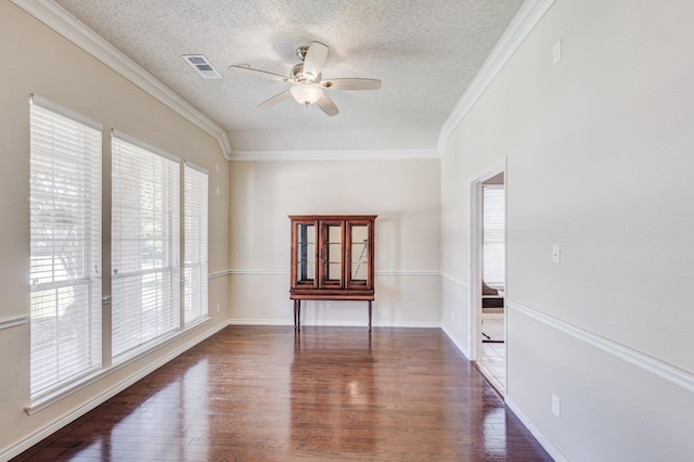 2611 Logan Dr, Mansfield, TX 76063 - empty room featuring a textured ceiling, ceiling fan, wood finished floors, and ornamental molding
