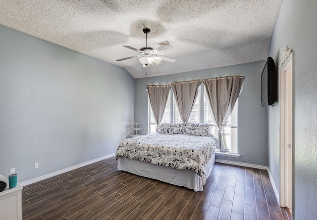 2611 Logan Dr, Mansfield, TX 76063 - bedroom with baseboards, dark wood-style floors, a textured ceiling, and ceiling fan