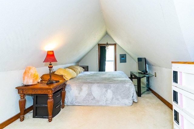 bedroom featuring lofted ceiling, carpet flooring, and baseboards