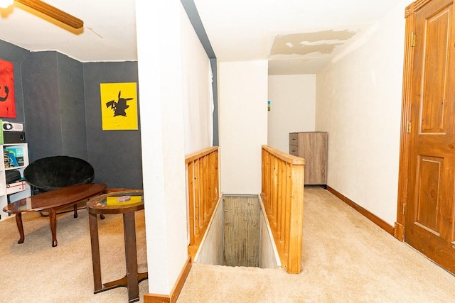 hall with carpet flooring