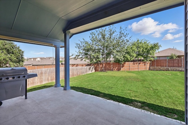 view of patio / terrace with a fenced backyard and a grill