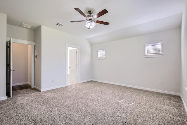 5019 Flanagan Dr, Forney, TX 75126 - unfurnished bedroom with carpet flooring, baseboards, a ceiling fan, ensuite bathroom, and vaulted ceiling
