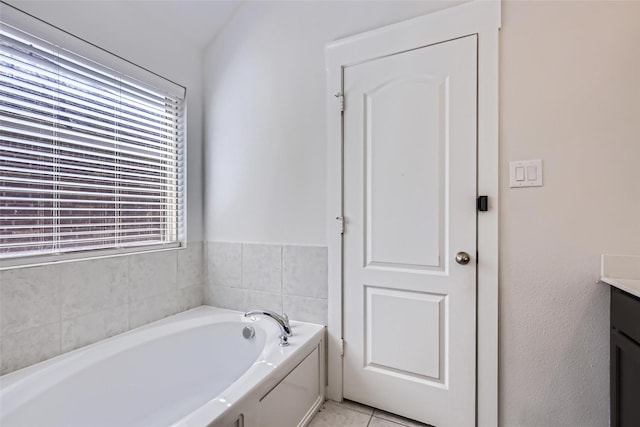 5019 Flanagan Dr, Forney, TX 75126 - bathroom featuring vanity, a garden tub, and tile patterned flooring