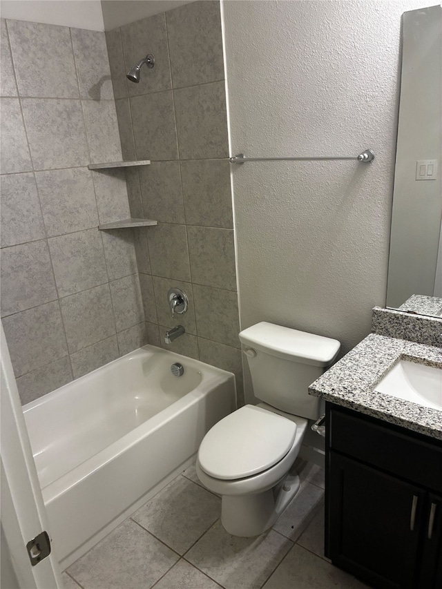 5019 Flanagan Dr, Forney, TX 75126 - bathroom with tile patterned flooring, toilet, vanity, shower / washtub combination, and a textured wall