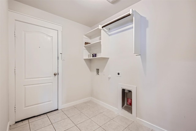 5019 Flanagan Dr, Forney, TX 75126 - laundry area featuring hookup for an electric dryer, light tile patterned floors, washer hookup, baseboards, and gas dryer hookup