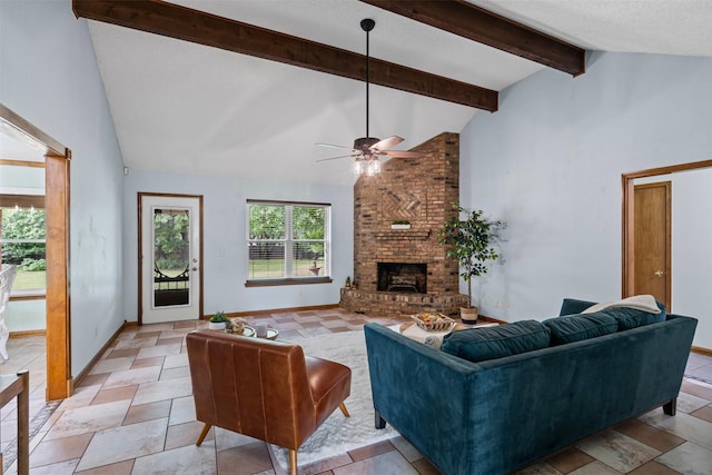 living room featuring beamed ceiling, ceiling fan, a fireplace, baseboards, and high vaulted ceiling