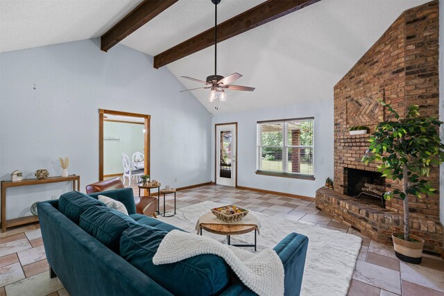 living room featuring baseboards, beam ceiling, a fireplace, a ceiling fan, and high vaulted ceiling