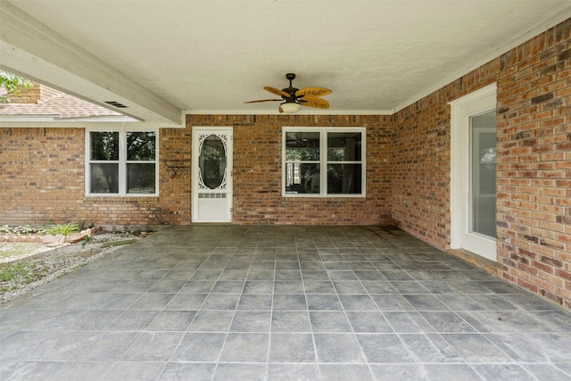 view of patio with a ceiling fan and visible vents