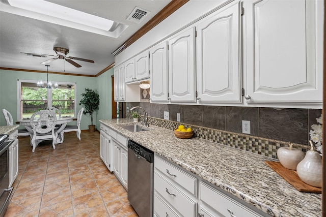 kitchen featuring stainless steel dishwasher, a ceiling fan, a sink, and tasteful backsplash