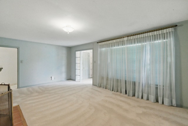 unfurnished living room featuring carpet flooring