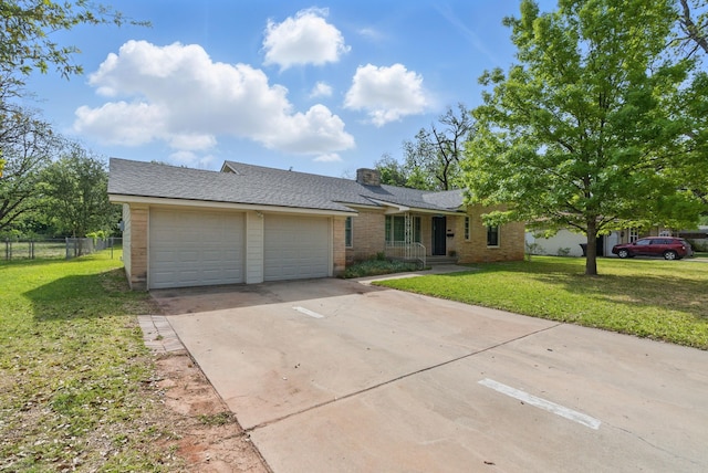 single story home featuring a chimney, a front lawn, concrete driveway, an attached garage, and fence