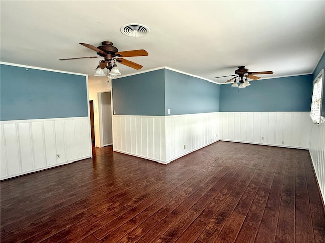 407 W Westhill Dr, Cleburne, TX 76033 - unfurnished room with a wainscoted wall, a ceiling fan, visible vents, and hardwood / wood-style flooring